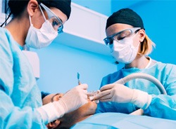 Dentists performing surgery