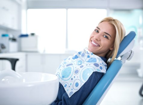 Smiling woman sitting in dental office