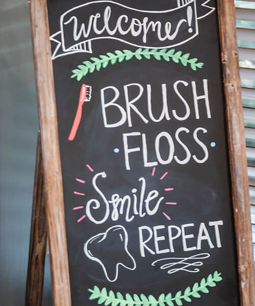 brush floss smile repeat sign in office